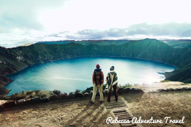 Couple admiring the view in Quilotoa crater in Ecuador.
