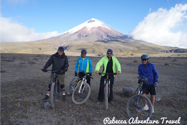 Travelers posing in front of the Cotopaxi