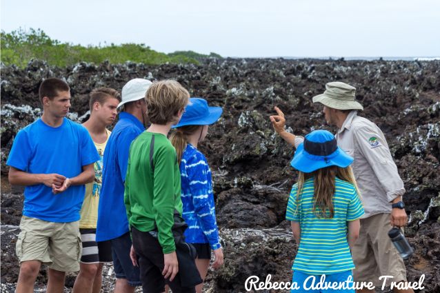 Family listening to a guide in the Galapagos Islands