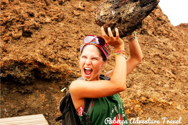 Girls holding a rock before starting her canyoning adventure