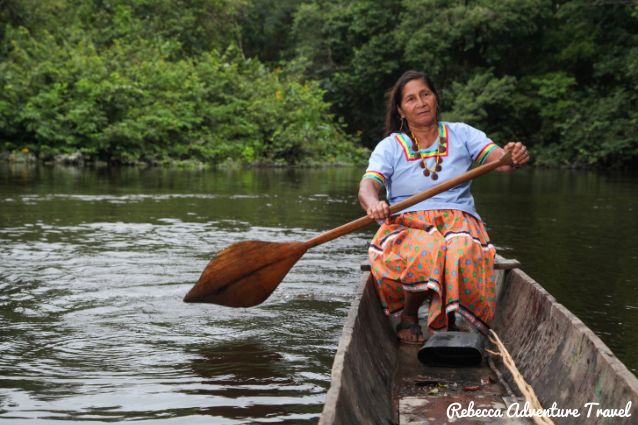 Indigenous woman Amazon canoe