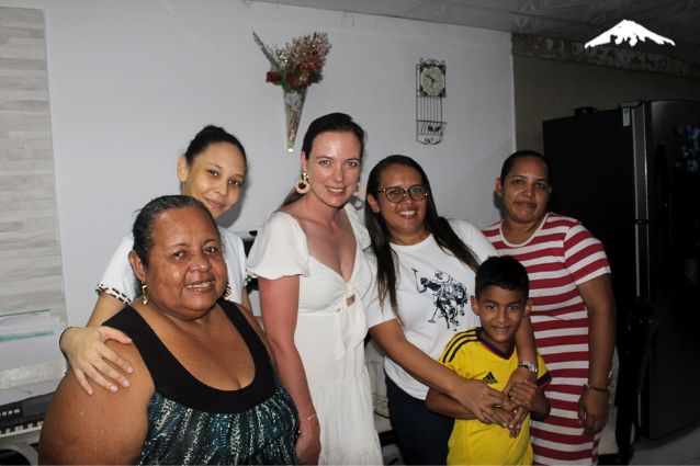 Rebecca as a traveler enjoying dinner with local family in Cartagena.