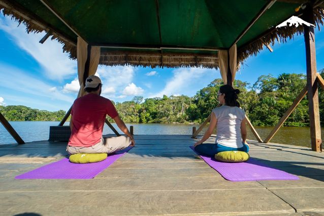 Our guests are enjoying a yoga session at the Amazon River in Ecuador